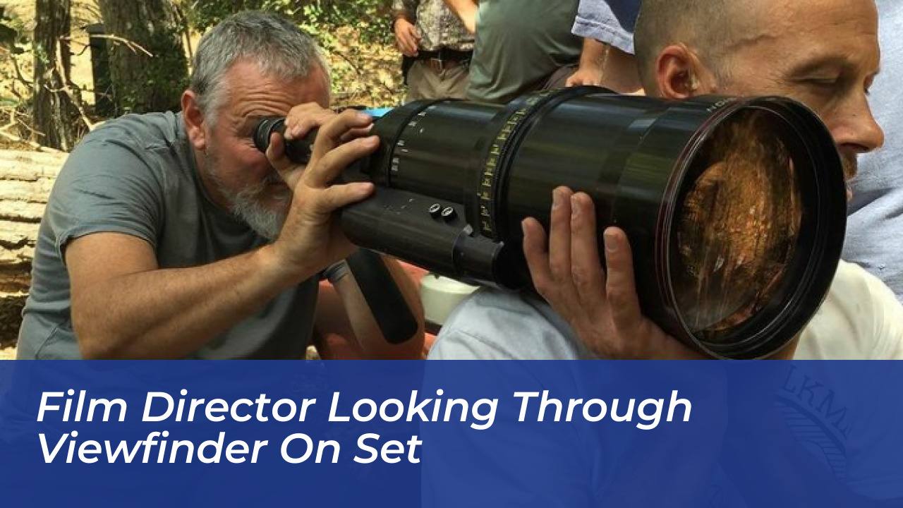 Christian Tafdrup Biography: Age, Movies, Net Worth, & Films 5 Film director looking through viewfinder on set