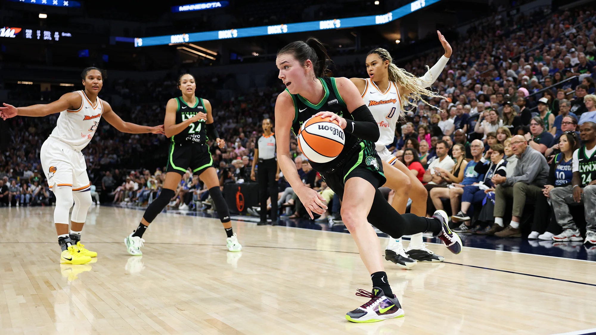 Wnba Basketball Players Competing In A High-intensity Playoff Game